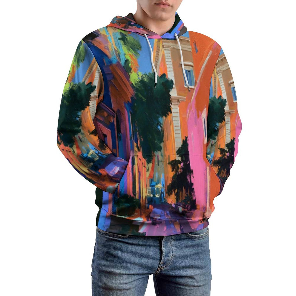 A man wearing a pullover hoodie with a vibrant, multicolored abstract cityscape print, paired with blue jeans, shown against a plain white background.