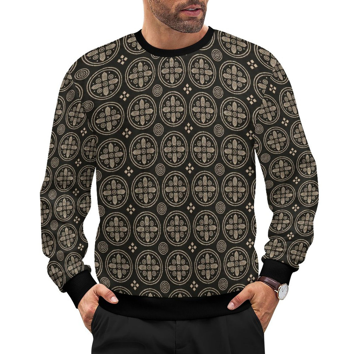 A man wearing a black crewneck sweatshirt with a beige geometric circular pattern, shown from the chin down against a plain white background.