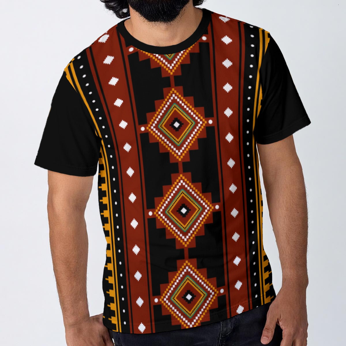 A man wearing a black short-sleeve t-shirt with a bold geometric pattern featuring red, orange, yellow, and white diamond motifs down the center, set against a plain light gray background.