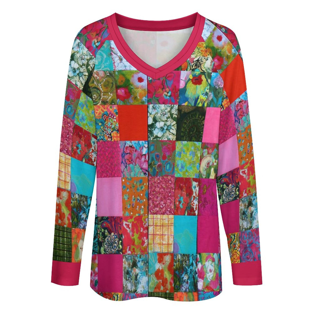 A long-sleeve V-neck top featuring a colorful patchwork print of various floral and patterned squares, with solid hot pink trim on the collar, cuffs, and hem.