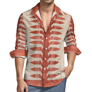 A man wearing a long-sleeve button-up shirt with a beige base and rust-orange geometric arrow-like patterns, shown from the chin to the hips against a plain white background.