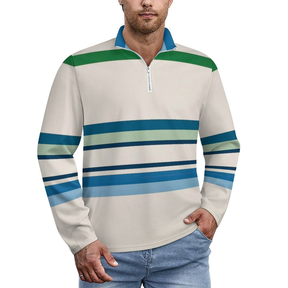A man wearing a long-sleeve quarter-zip pullover shirt with horizontal stripes in shades of blue, teal, and green on an off-white base, paired with blue jeans against a plain white background.